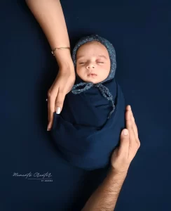 Newborn baby in hand of Mom & Dad