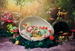 Newborn baby in Dinosour Prop