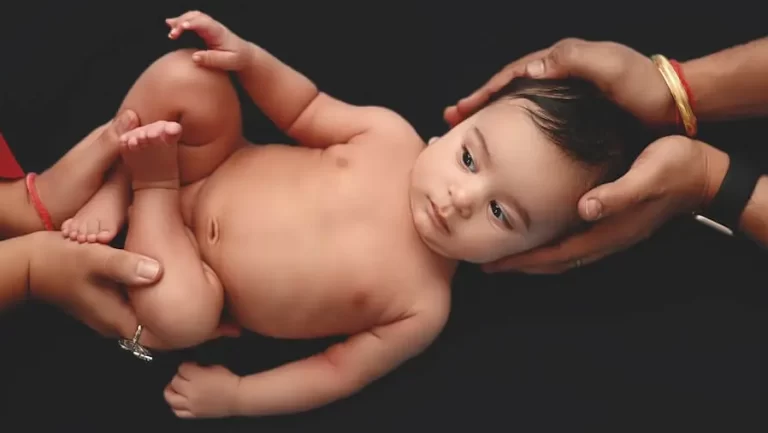 New born baby shoot in Parents Hand