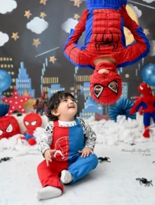 best-cake-smash-photographer-delhi-spiderman-sibling-upside-down-toddler-laughing-85