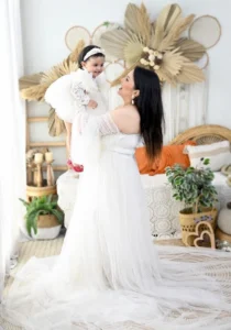 first-birthday-photoshoot-gurgaon-mother-lifting-baby-white-flowing-gown-boho-27