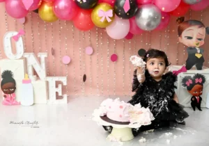 pre-birthday-portrait-session-delhi-boss-baby-girl-cake-smash-eating-cake-black-dress-80