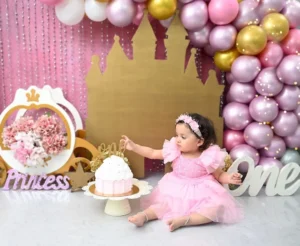 pre-birthday-shoot-studio-delhi-cake-smash-princess-pink-ruffle-castle-balloon-arch-28