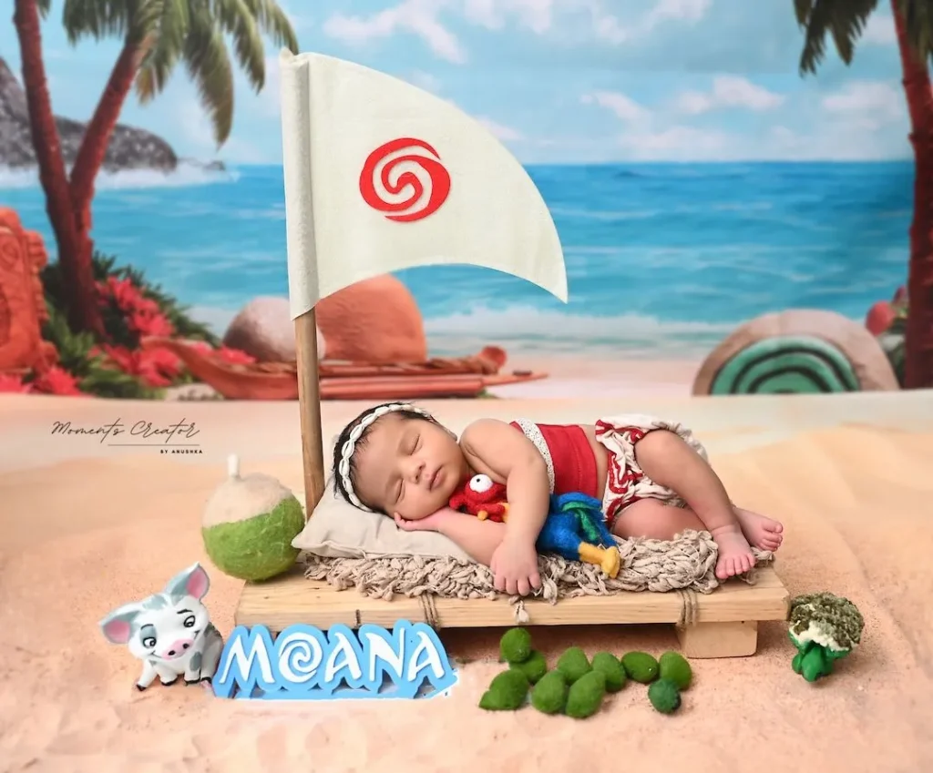 studio-newborn-shoot-delhi-moana-theme-red-outfit-mini-raft-beach-backdrop-46