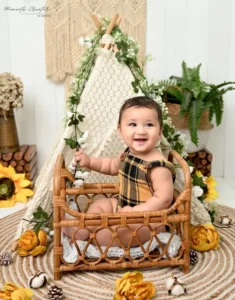 best sitter photographer delhi ncr baby boy plaid romper boho teepee autumn rattan bed